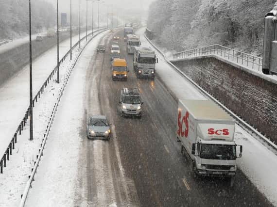 Slow going in the snow on the M6 at Orrell