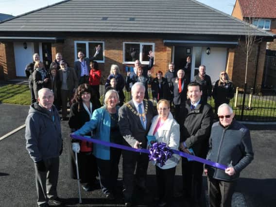 The Mayor of Preston Coun Brian Rollo cuts the ribbon at the Community Gateway celebrations at the end of our bungalow development in Ingol