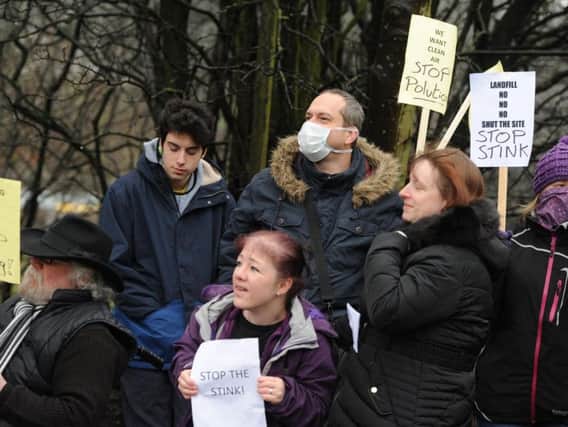 Protesters demand action over smells at the Clayton Hall tip