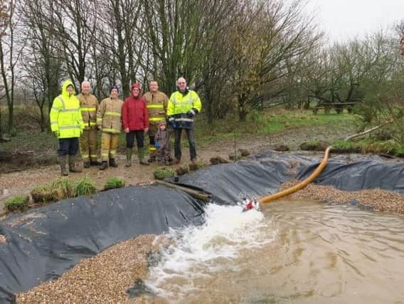 Firefighters from Garstang Fire Station turned up to fill the pond.