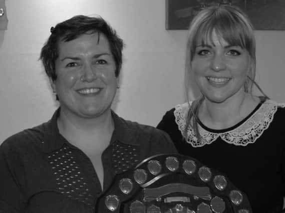 Owner Peace Townsend (left) and barmaid Lucy Gillhespy their trophy.