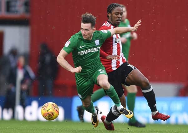 Preston's Alan Browne and Preston North End's Romaine Sawyers