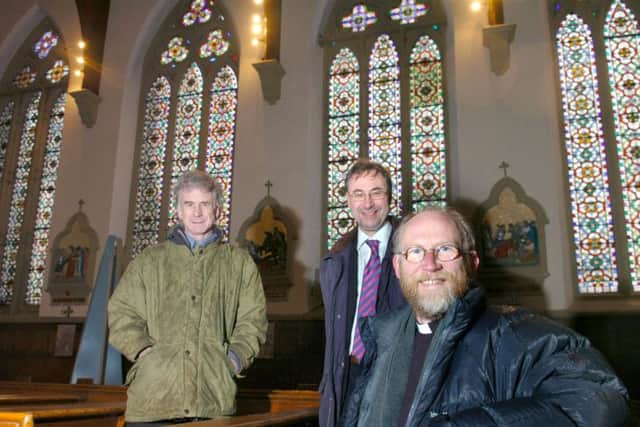 Pictured at St. Walburge's, Preston , from left, English Heritage Historic Buildings Architect Tim Wilkins, English Heritage Regional Director Henry Owen-John and then-Parish Priest Father Paul Swarbrick.