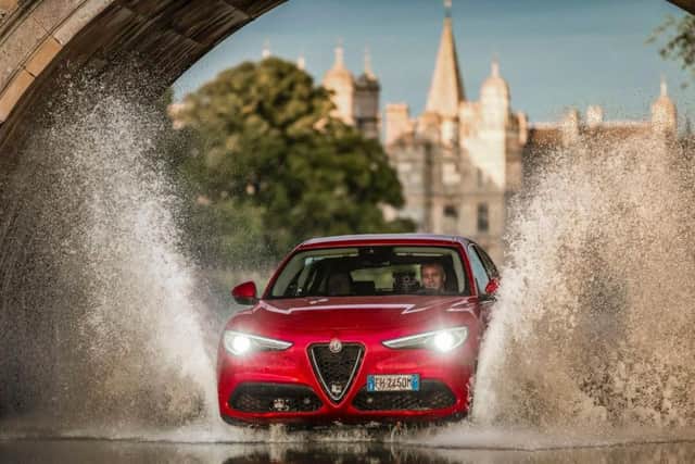 Top Gear presenter Matt LeBlanc driving an Alfa Romeo