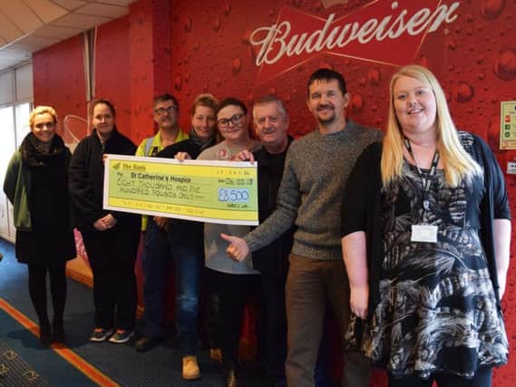 Staff at InBev brewery in Samlesbury have raised 8,500 for St Catherines Hospice