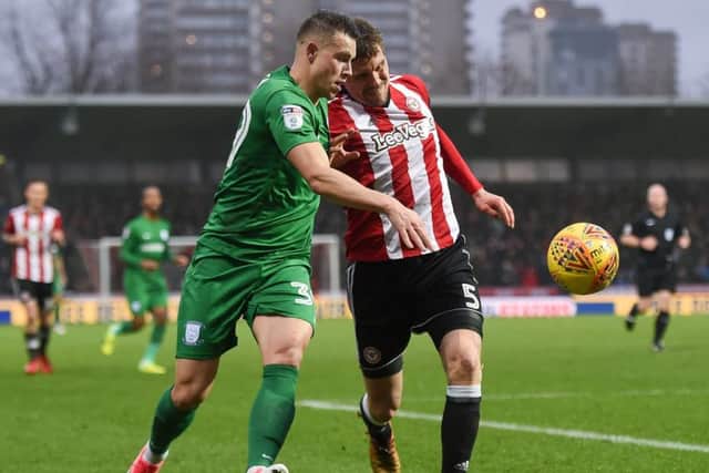 Bodin battles with Brentford's Andreas Bjelland last time out at Griffin Park.