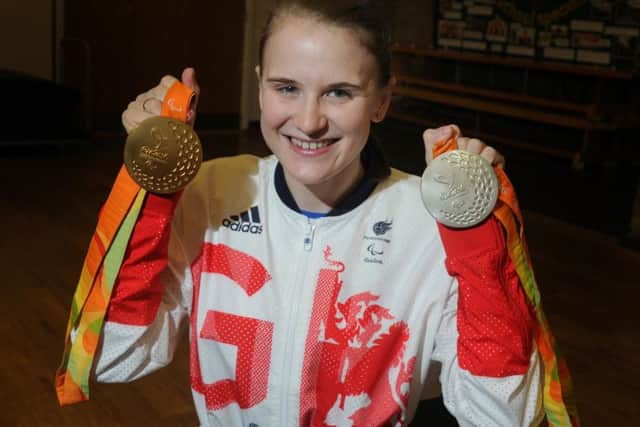 Stephanie Slater shows off her medals.