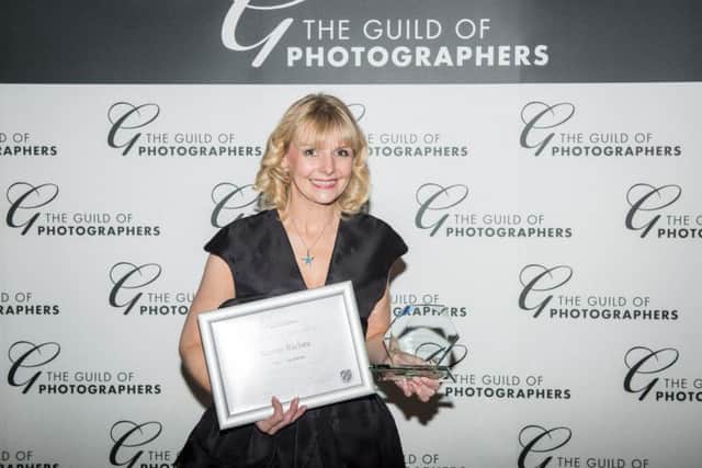Photographer Karen Riches collects her award