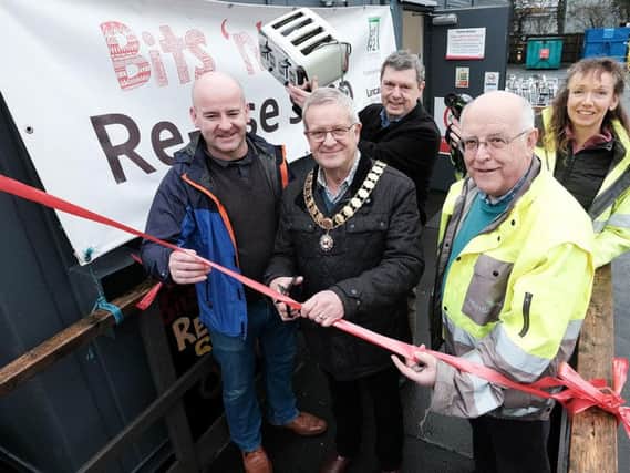 Mayor of Garstang, Coun Peter Ryder (second from left) re-opens the shop.