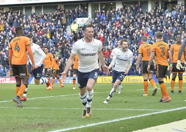 Alan Browne celebrates giving North End the lead against Wolves, pursued by team-mates Josh Earl and Tom Barkhuizen