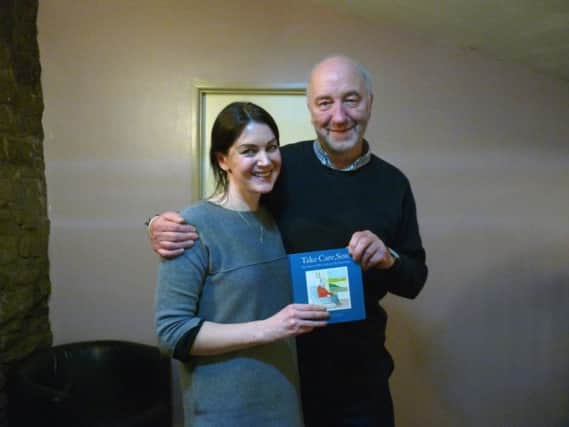Claire Williams, founder of Aire Studio, with Tony Husband as he showcases his book, Take Care, Son