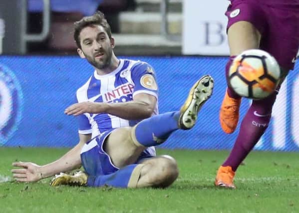Wigan's Will Grigg fires home the winner to knock Manchester City out of the FA Cup