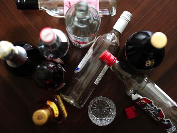 Empty bottles of alcohol, as new research suggests that heavy drinking may be a major risk factor for early-onset dementia. Photo credit: Ian West/PA Wire