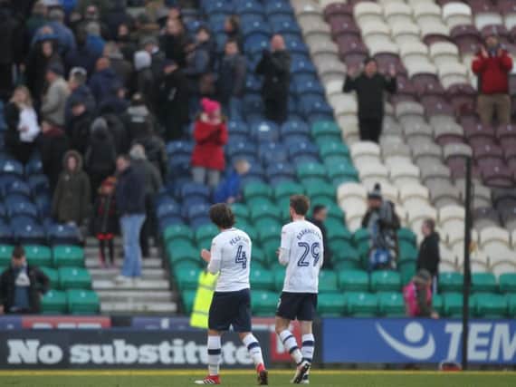 Ben Pearson and Tom Barkhuizen leave the field after Preston's defeat to Ipswich.