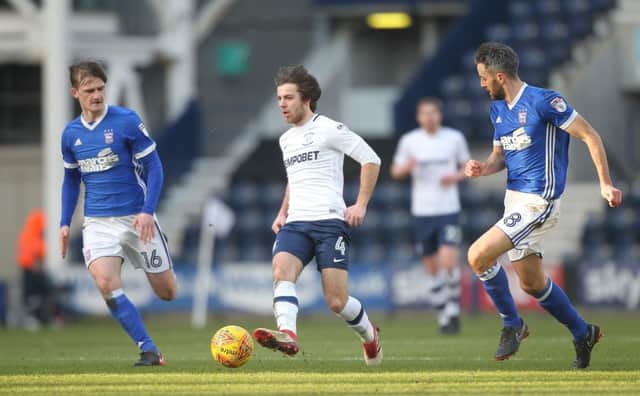 Preston North End's Ben Pearson tries to find a way through the Ipswich defence