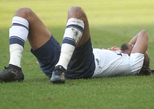 PNE midfielder Daniel Johnson flat out on the Deepdale turf during the Wolves game