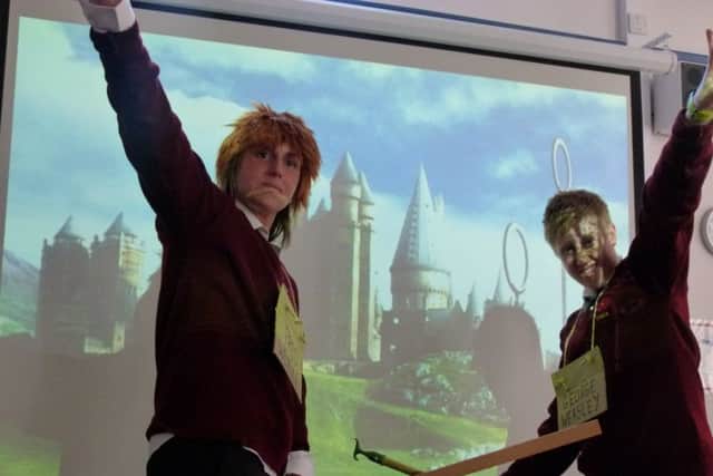 LGGS Harry Potter Day: Mrs Lucy Russel and Miss Leanne Sharples (PE Department) as Fred and George Weasley riding on Quidditch sticks