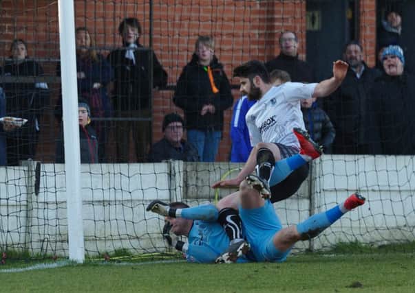 Adam Roscoe nets for Bamber Bridge against Scarborough but the goal is disallowed