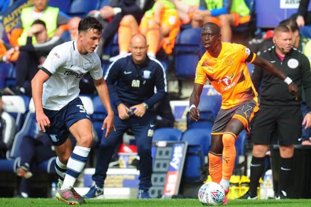 Earl tracks Moduo Barrow during his debut against Reading, watched by Alex Neil