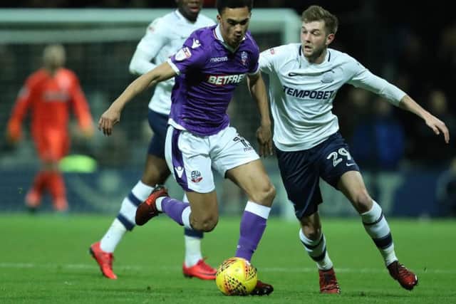Tom Barkhuizen battles with Antonee Robinson during the 0-0 draw between the sides at Deepdale earlier in the season.