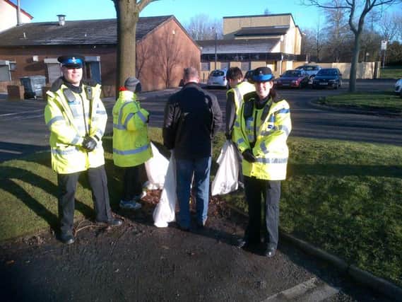 Community officers carrying out a litter pick on the Clayton Brook estate