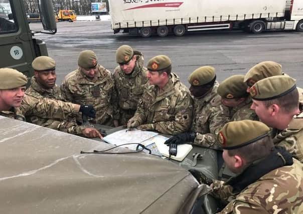Members of the 2nd Battalion of the Duke of Lancaster's Regiment (2 Lancs) based at Weeton, have been helping emergency services to assist stranded passengers on the snow-bound M52 near Rochdale.
