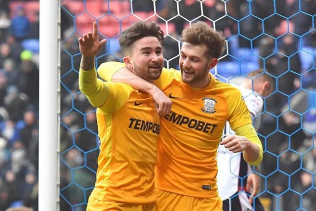 Sean Maguire celebrates his second goal and PNE's third with Tom Barkhuizen.