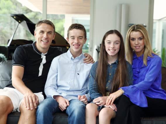 Julie with Phil, and their children Harvey, 15 and Isabella, 14.