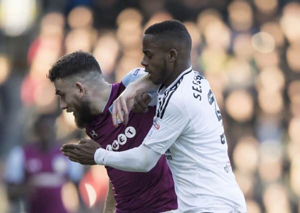 Ryan Sessegnon tackles Aston Villa's Robert Snodgrass last month