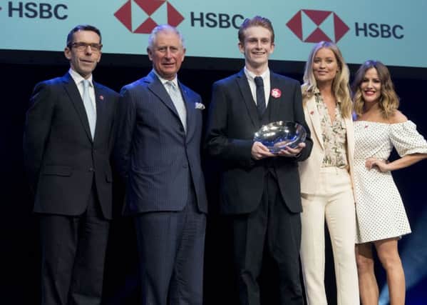 Breakthrough Award winner Jack Lucas (centre) on stage with the Prince of Wales, Laura Whitmore (second right) and Caroline Flack (right) at the Prince's Trust Awards at the London Palladium. PRESS ASSOCIATION Photo. Picture date: Tuesday March 6, 2018. See PA story ROYAL Charles. Photo credit should read: Geoff Pugh/The Daily Telegraph/PA Wire