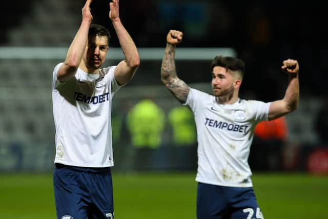 Sean Maguire celebrates at the final whistle with Paul Huntington