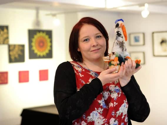 Victoria Cank at her exhibition Insight which shines a spotlight on the difficulties people with mental health conditions face.