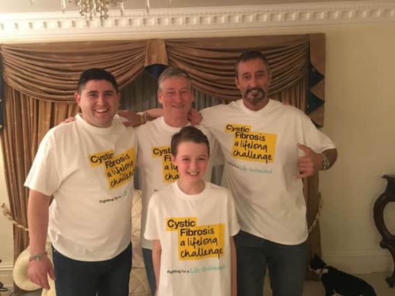 Sam Worden, 30, Andy Bell, 61, David Finch, 58, and David Capitan, 11, get ready for their Machu Picchu trek for Cystic Fibrosis Trust