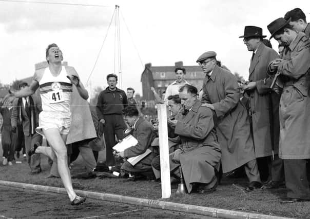 Roger Bannister breaks the four-minute mile barrier in 1954 in Oxford  his time was recorded as 3:59.4