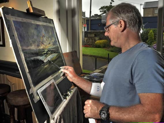 Les Darlow from Blackpool draws Jeffrey Hill at the 'Create Longridge' art festival last year.