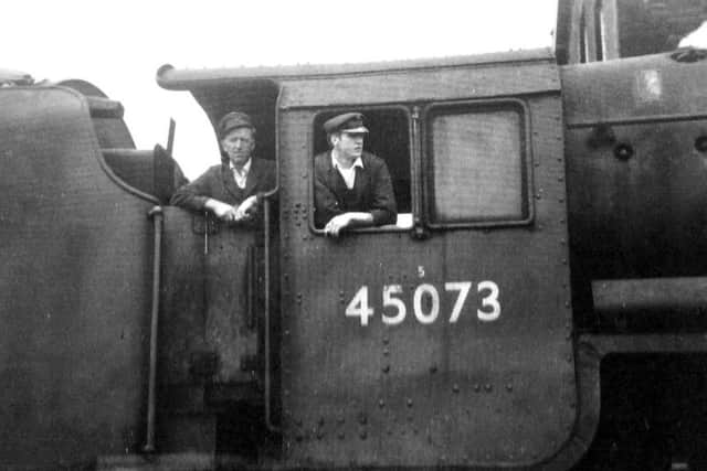 Driver Clifford Nelson, left, and fireman John Fletcher ready to set off