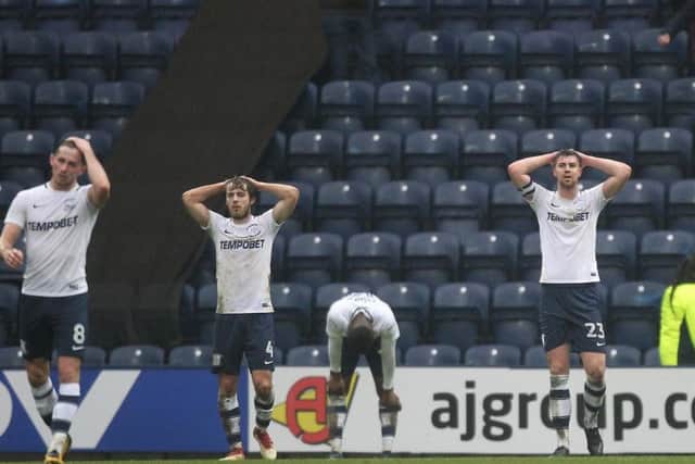 Alan Browne, Ben Pearson, Darnell Fisher and Paul Huntington show their disappointment after Fulham's late winner