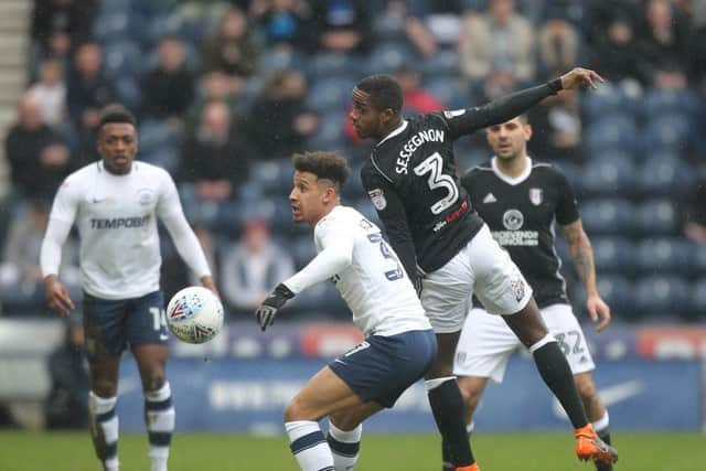 Callum Robinson is challenged by Ryan Sessegnon