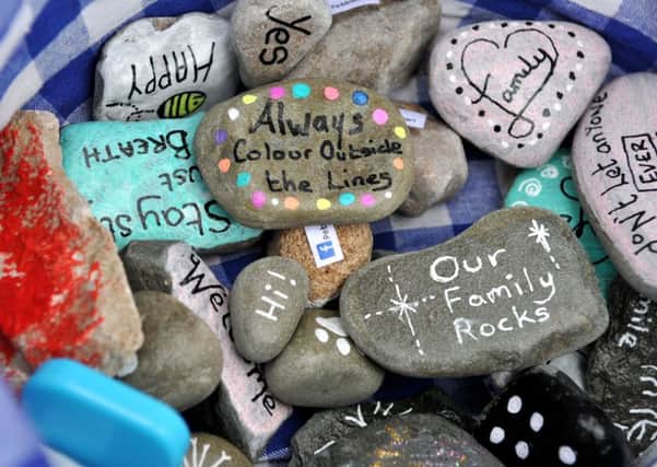 Photo Neil Cross
Jacky Burns has started off a new craze in the Heysham area called Pebbleart - she finds pebbles on the beach, paints and varnishes them, then hides them in the local area for people to find, with her grandchildren Olivia, Leo and Calvin