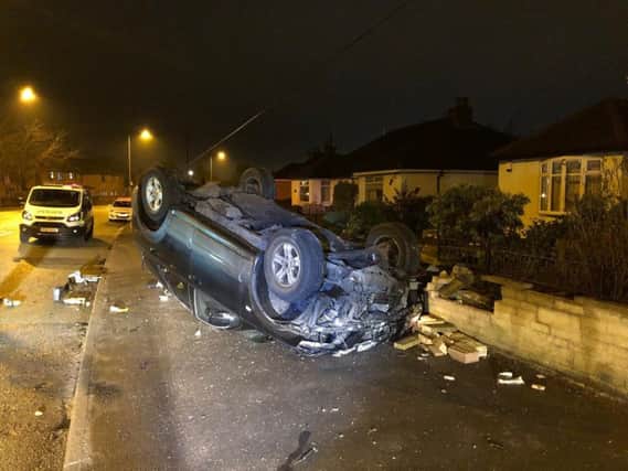 A car smashed into a garden wall and landed on its roof in Walton-le-Dale overnight, say police.