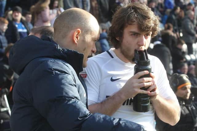 Preston manager Alex Neil gives instructions to Ben Pearson