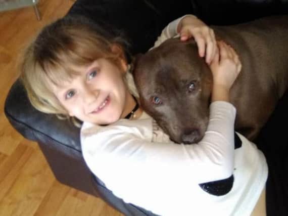 Avya (eight) with Blue, her Staffie cross which was stolen on Saturday (March 10).