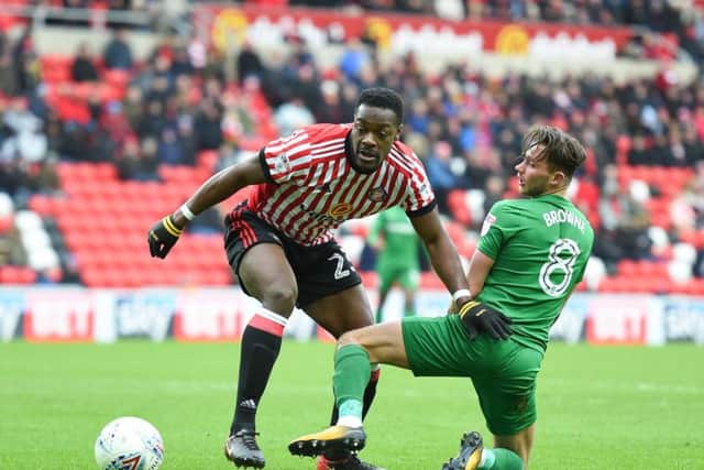 North End midfielder Alan Browne challenges Lamine Kone