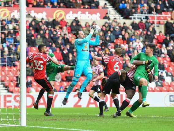 Sunderland goalkeeper Lee Camp claims the ball under pressure.