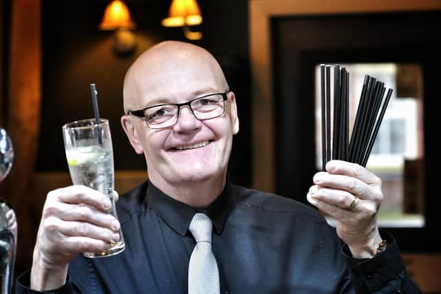 Withy Arms, Leyland, pub landlord John Travill with the new paper straws after banning plastic straws