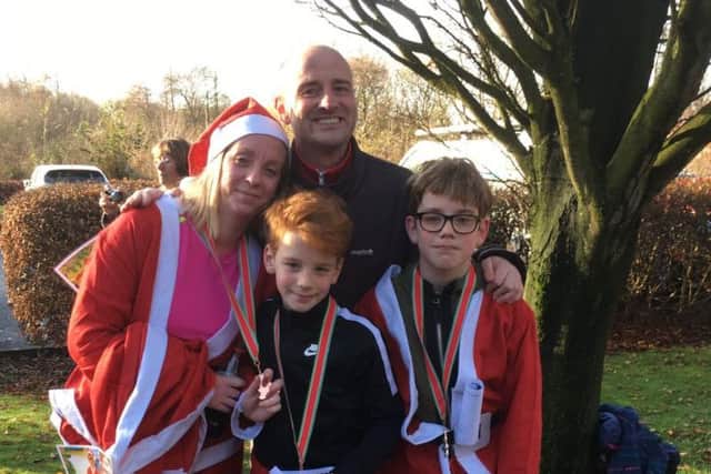 Kevin Brown took part in last year's Santa Dash for St Catherine's Hospice with his wife Julie and two sons Jamie and Harry