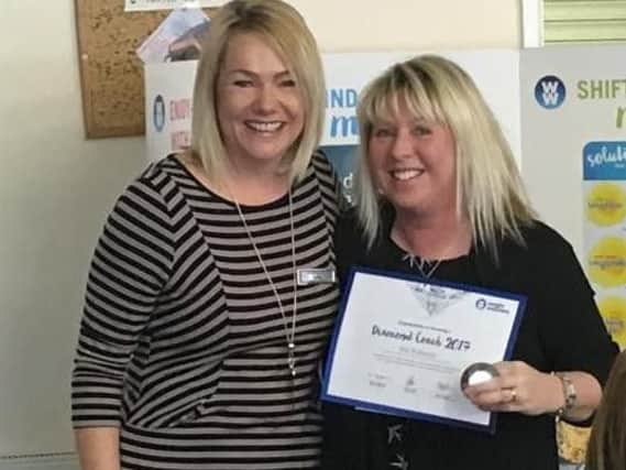 Kim Robinson (right) was awarded Weight Watchers Diamond Coach status at her meeting in Ingol Methodist Church at Ingol/Preston, from area service manager Louise Horrocks