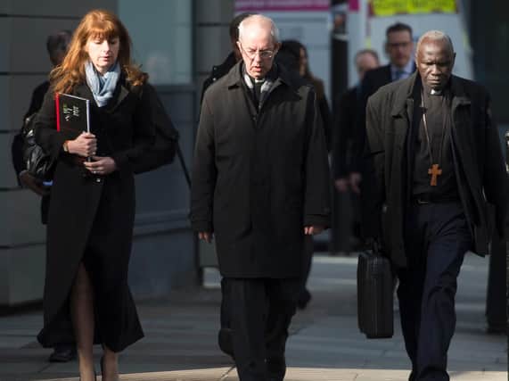 (left to right) Director of Communications for the Archbishop of Canterbury Ailsa Anderson, Archbishop of Canterbury Justin Welby and Bishop Anthony Poggo, the Archbishop's Adviser on Anglican Communion Affairs. Photo credit: David Mirzoeff/PA Wire