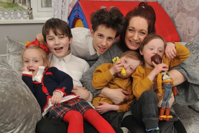 Photo Neil Cross
Twins Alfie and Arthur who have Down's Syndrome and are five. with their mum Emma Lowe, and Harry, Ben and Elsie