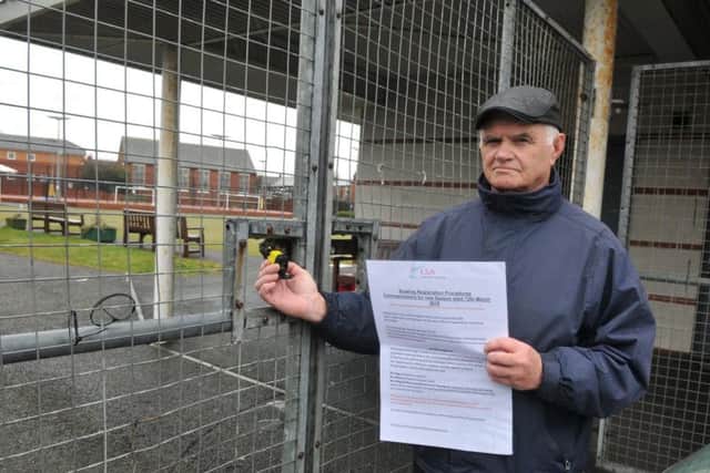 Chairman of the crown green bowlers, Les Crosby, outside the padlocked gates of Leyland Sports Association two weeks ago. Photo: Neil Cross.